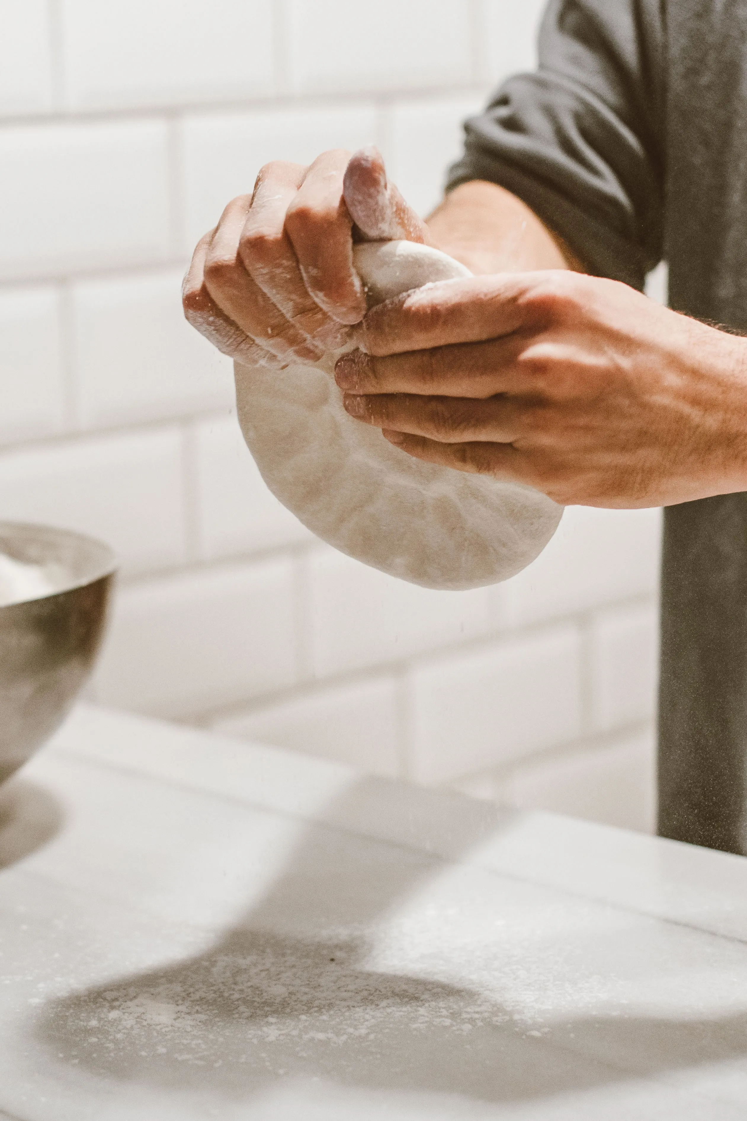 Photo: Hands preparing bread dough